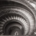 grayscale photo of momo spiral staircase in vatican city
