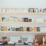 various literature on wooden shelves in modern bookstore