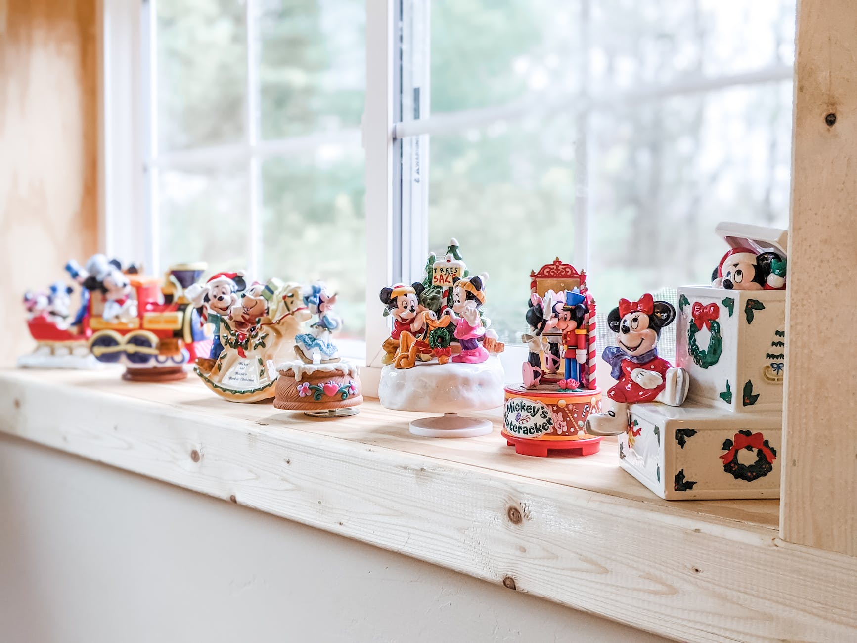 figurines beside the glass window