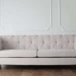 photo of white couch on wooden floor