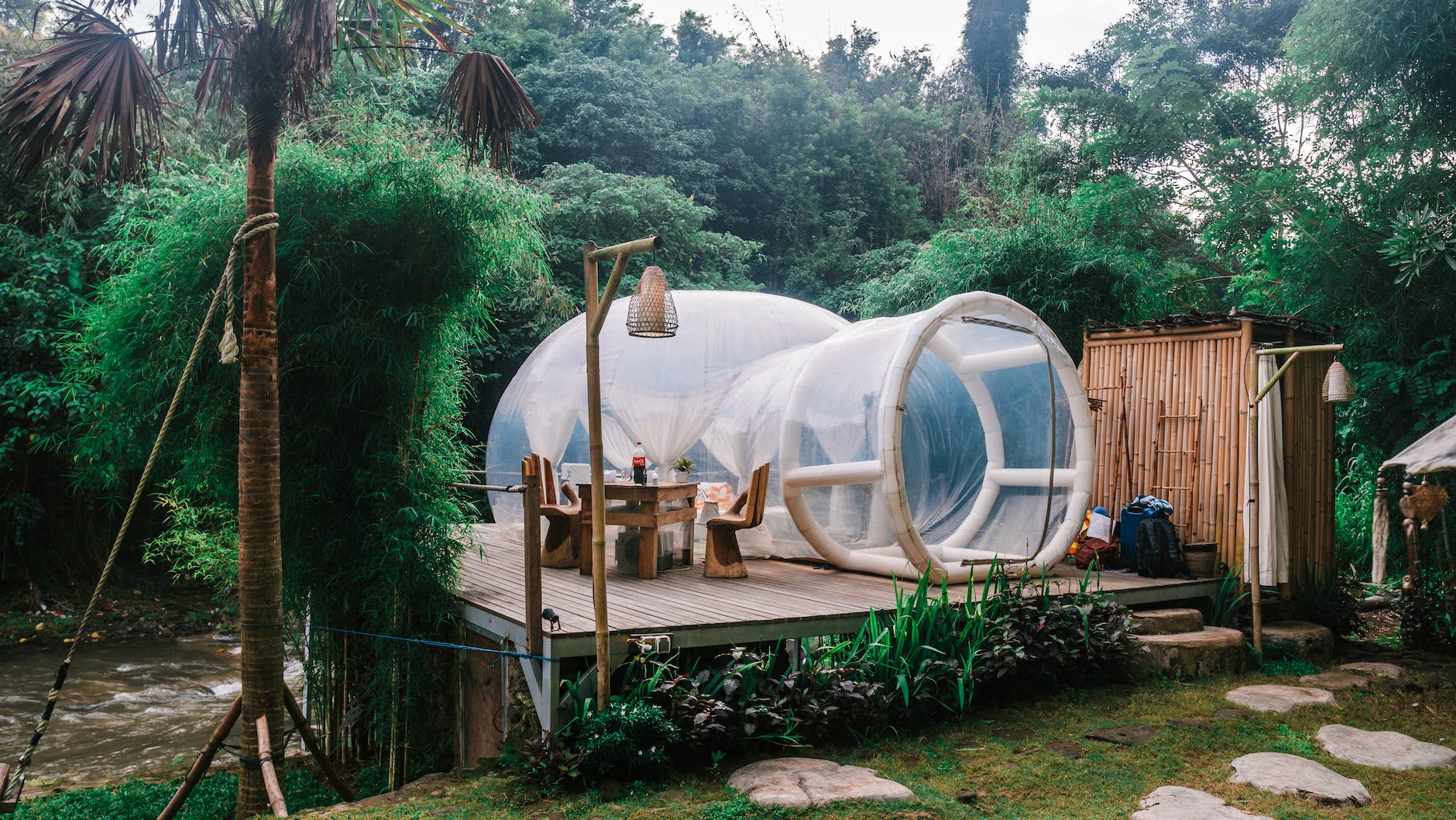 exterior of cute bubble tent in tropical garden