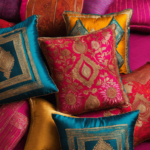 An image showcasing vibrant and intricately patterned old sarees transformed into stunning cushion covers, effortlessly adding a touch of elegance and cultural charm to any living space