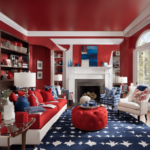 An image featuring a captivating living room with a vibrant, patriotic color scheme of bold red walls, crisp white furniture, and tasteful blue accents