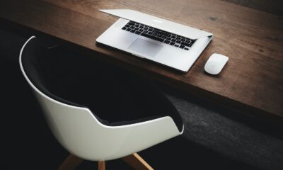 Apple MacBook beside computer mouse on table