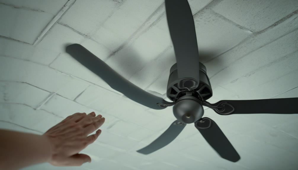examining the ceiling fan blades